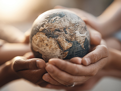 Hands holding a globe
